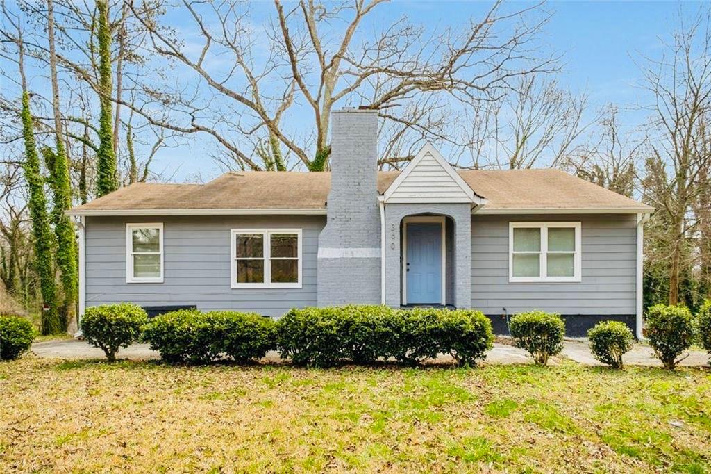 360 Peyton Road Southwest Atlanta, GA 30311 - Photo 1 of 1 a front view of a house with a yard