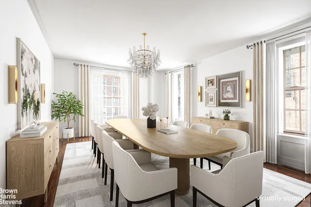 a view of a dining room with furniture and window