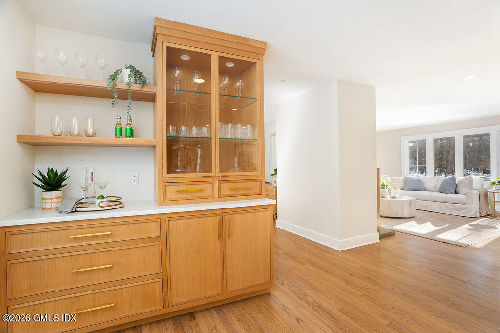 49 Salisbury Road Darien, CT 06820 - Photo 12 of 40 a hallway with cabinet and two windows