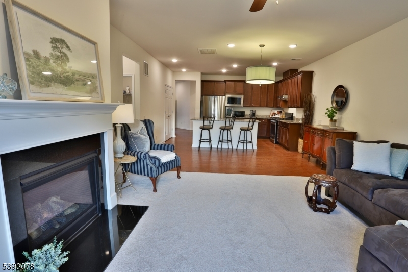 18 Barnett Road Flemington, NJ 08822 - Photo 12 of 25 a living room with furniture a rug and a fireplace