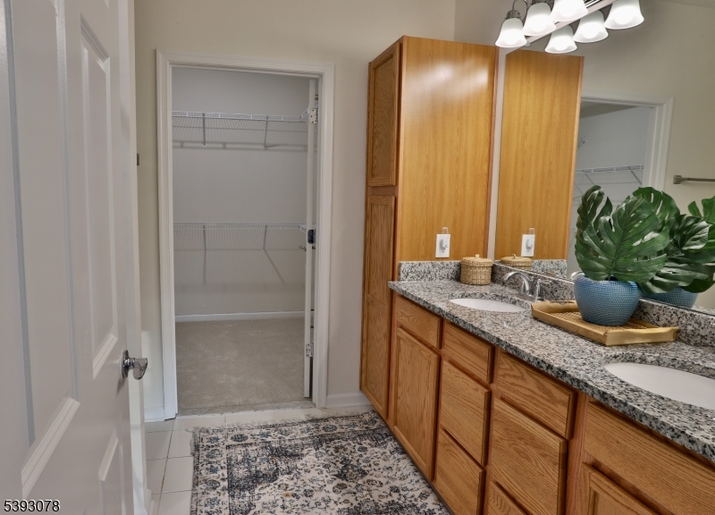 18 Barnett Road Flemington, NJ 08822 - Photo 14 of 25 a bathroom with a granite countertop sink and a mirror