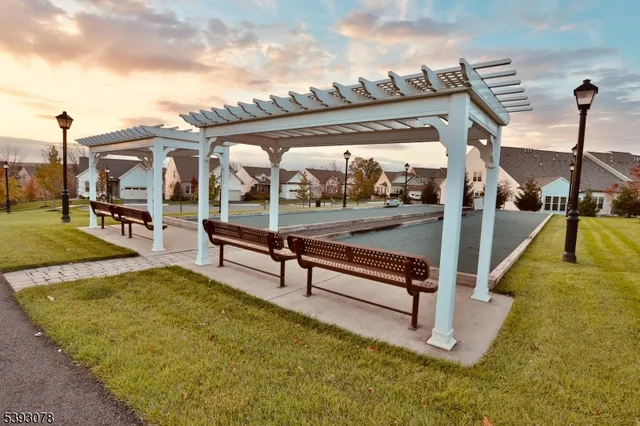 a view of swimming pool with a patio and a yard