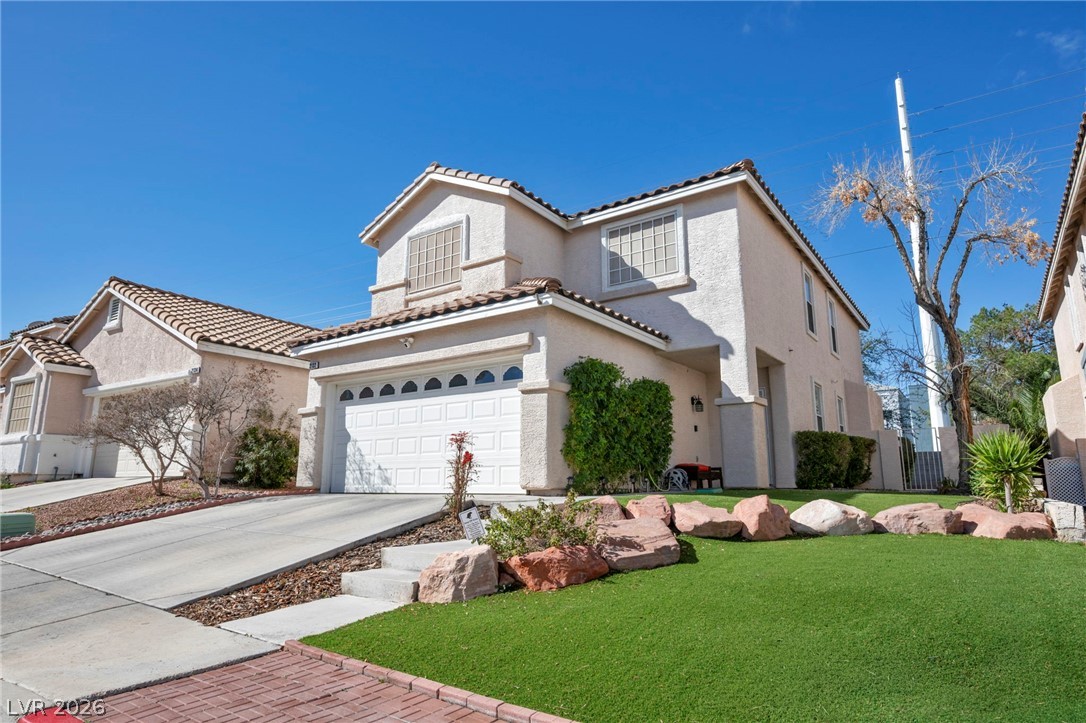 2132 Polynesia Circle Henderson, NV 89074 - Photo 21 of 25 Low-maintenance astroturf and a covered patio create the perfect outdoor space for relaxing or entertaining year-round.