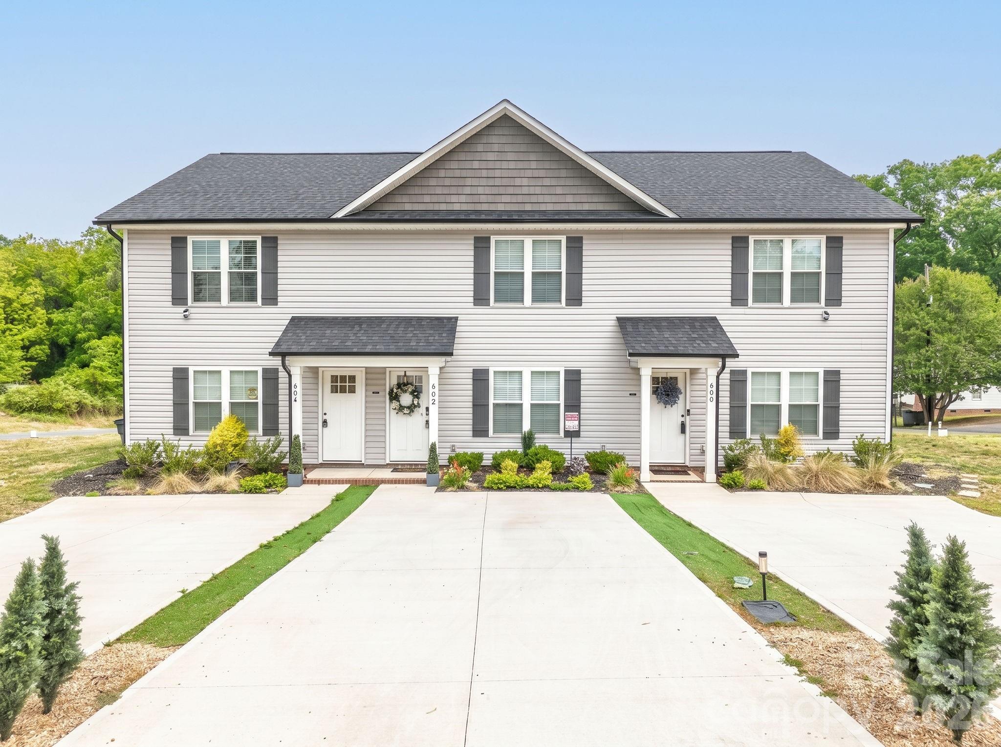 602 West 8th Street Kannapolis, NC 28081 - Photo 1 of 10 a front view of a house with a yard