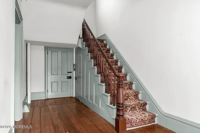a view of entryway with wooden floor