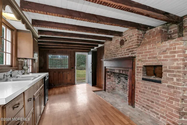 a kitchen with a refrigerator and a sink