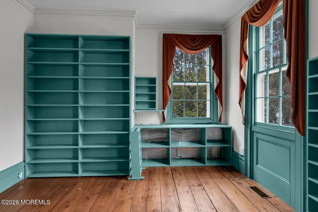 a view of a room with cabinets and a window