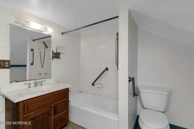a bathroom with a sink a toilet and a bathtub
