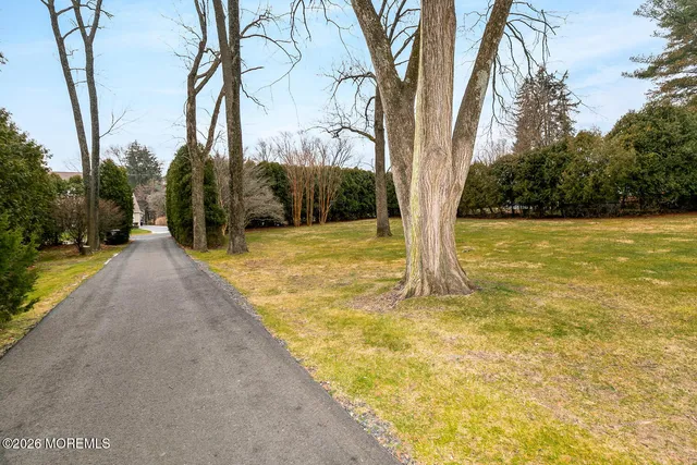 a view of yard with swimming pool