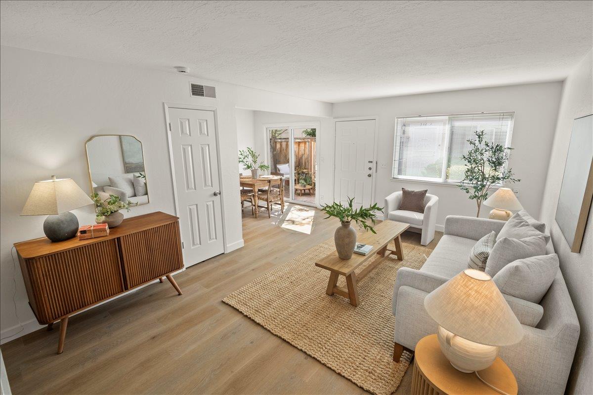 284 Rio Verde Place, Unit 3 Milpitas, CA 95035 - Photo 13 of 29 a living room with furniture and wooden floor