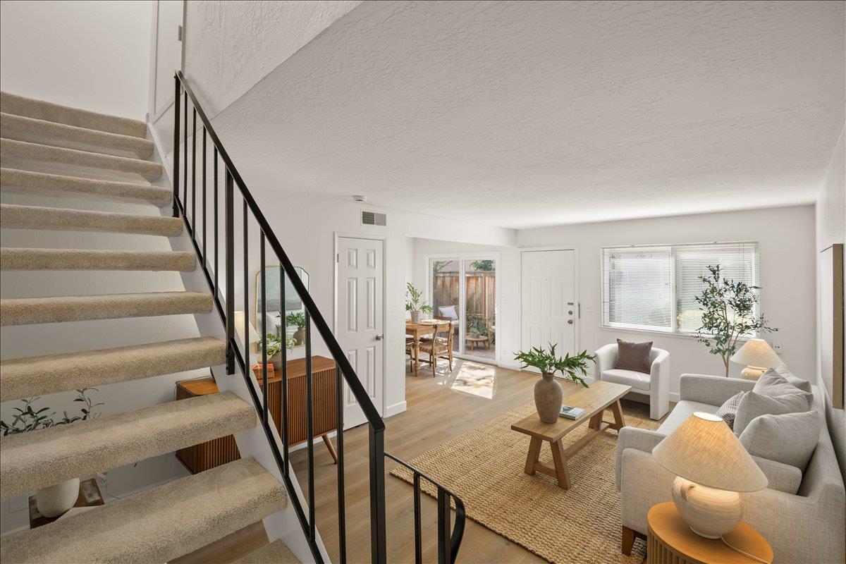 284 Rio Verde Place, Unit 3 Milpitas, CA 95035 - Photo 14 of 29 a living room with furniture and stairs