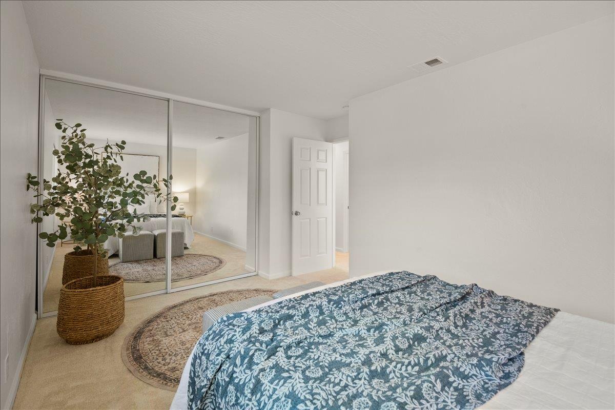 284 Rio Verde Place, Unit 3 Milpitas, CA 95035 - Photo 16 of 29 a bedroom with a bed and a potted plant