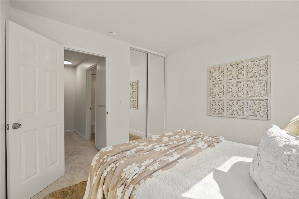 284 Rio Verde Place, Unit 3 Milpitas, CA 95035 - Photo 18 of 29 a bedroom with a bed and a painting on the wall