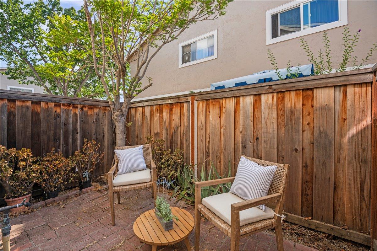 284 Rio Verde Place, Unit 3 Milpitas, CA 95035 - Photo 20 of 29 a patio with wooden table and chairs