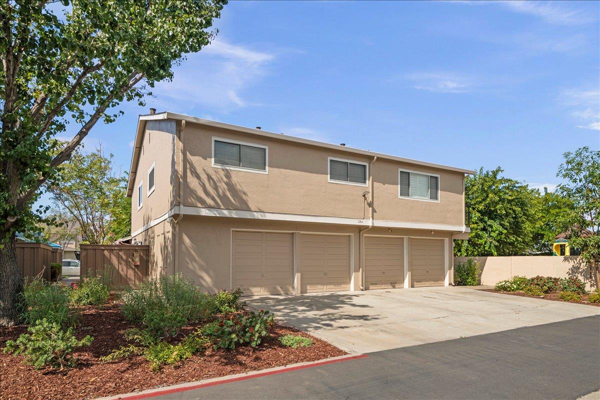284 Rio Verde Place, Unit 3 Milpitas, CA 95035 - Photo 21 of 29 a front view of a house with a yard