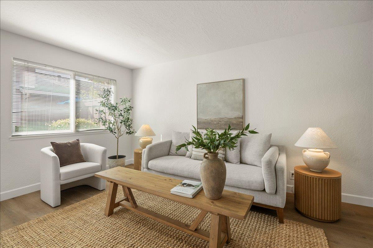 284 Rio Verde Place, Unit 3 Milpitas, CA 95035 - Photo 4 of 29 a living room with furniture and a potted plant