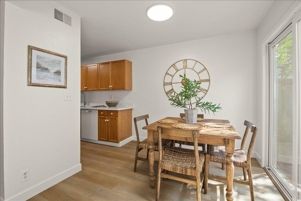284 Rio Verde Place, Unit 3 Milpitas, CA 95035 - Photo 6 of 29 a view of a dining room with furniture and wooden floor