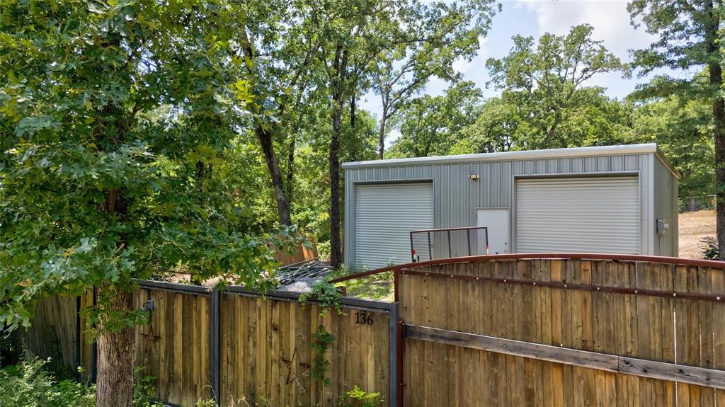 a view of outdoor space with wooden fence