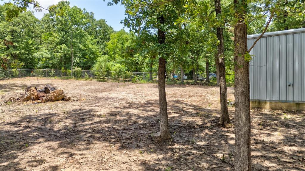 136 Kings Row Malakoff, TX 75148 - Photo 15 of 22 a view of a yard with large trees
