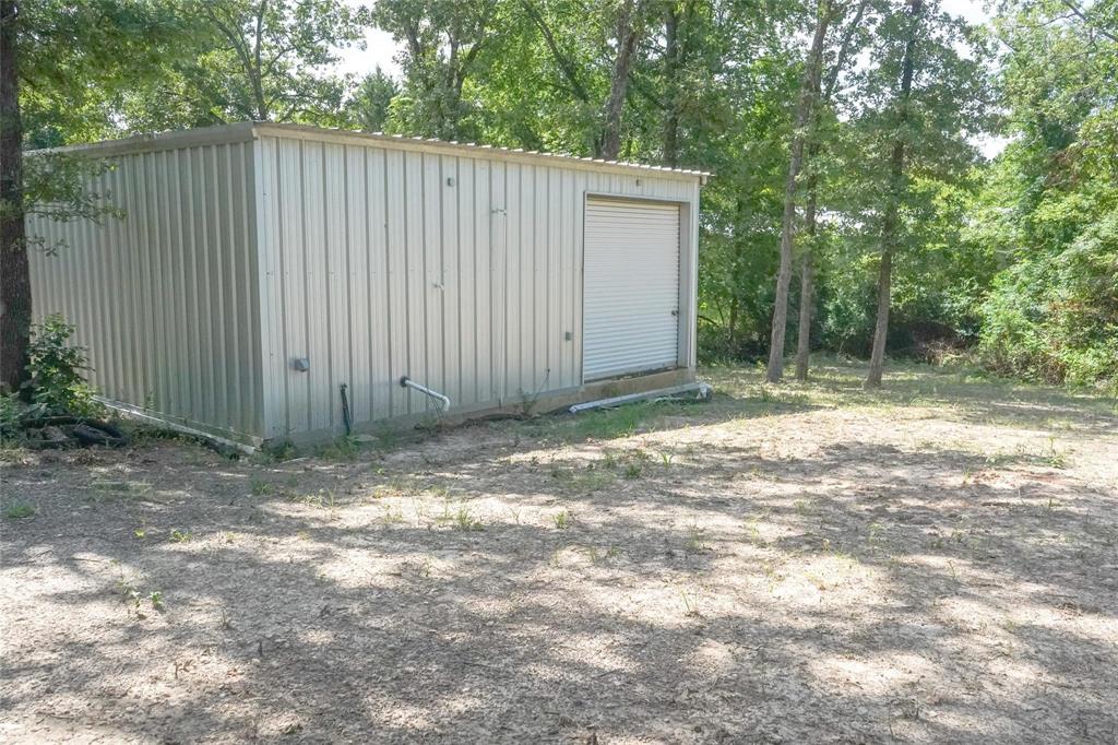 136 Kings Row Malakoff, TX 75148 - Photo 21 of 22 a view of a backyard with wooden fence