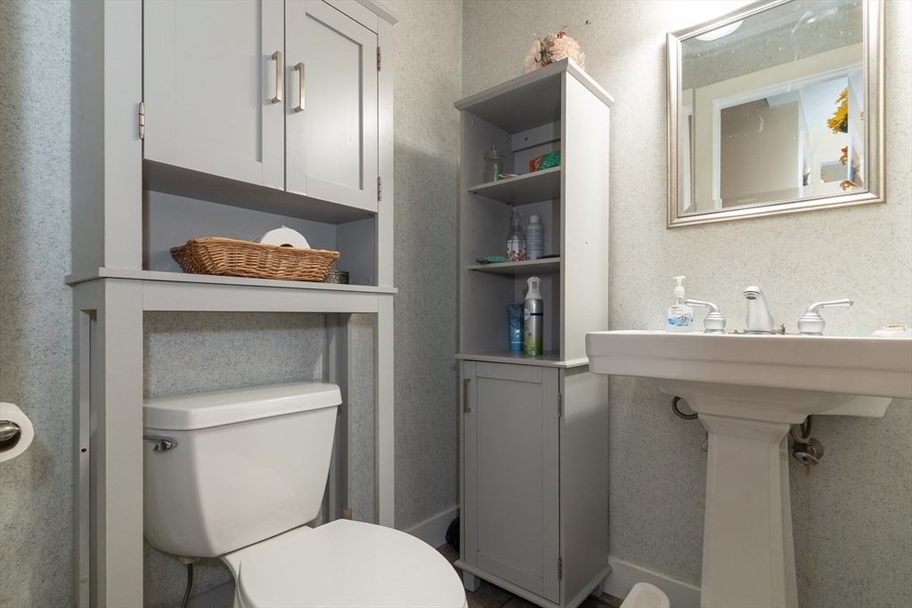 157 School Street North Brookfield, MA 01535 - Photo 14 of 29 a bathroom with a toilet sink and mirror