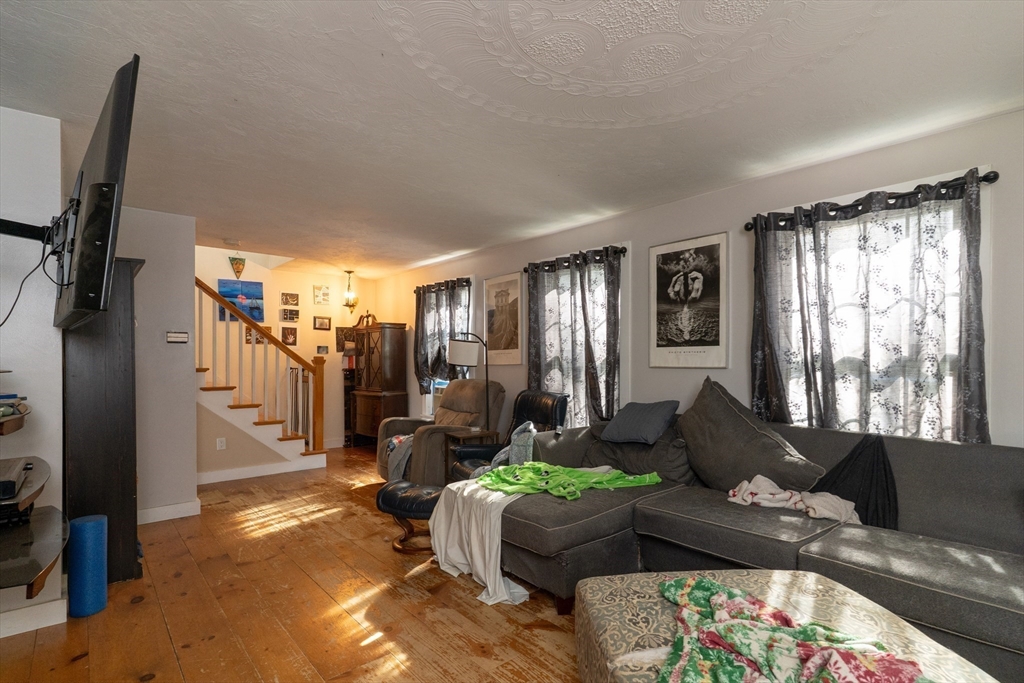 157 School Street North Brookfield, MA 01535 - Photo 20 of 29 a living room with furniture and a flat screen tv