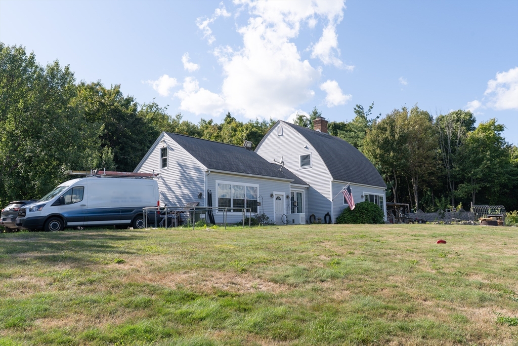 157 School Street North Brookfield, MA 01535 - Photo 3 of 29 a view of a house with a big yard and large trees