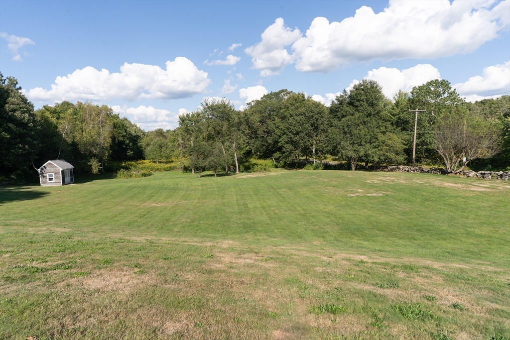 157 School Street North Brookfield, MA 01535 - Photo 6 of 29 a view of a field with an trees in the background