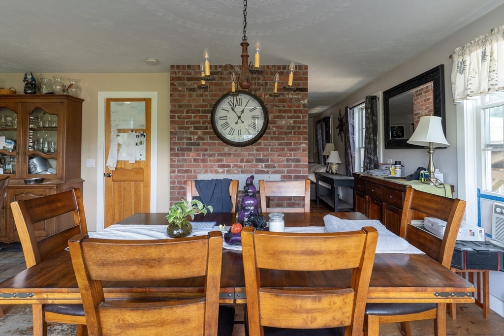 157 School Street North Brookfield, MA 01535 - Photo 7 of 29 a living room with fireplace furniture and a clock