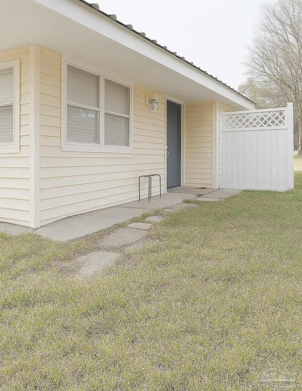 6274 Munson Highway Milton, FL 32570 - Photo 4 of 26 a view of a house with a backyard