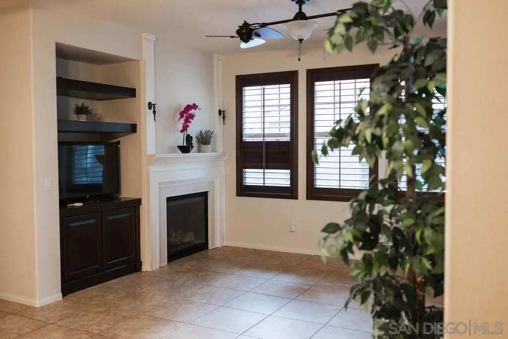 1808 Cyan Lane Chula Vista, CA 91913 - Photo 1 of 43 a living room with a fireplace and potted plants