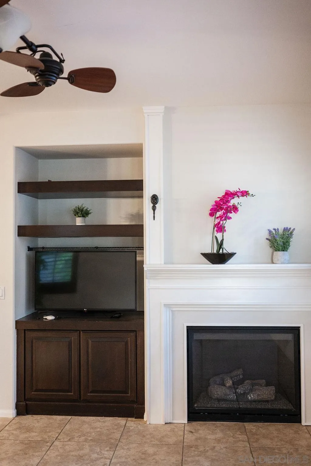 1808 Cyan Lane Chula Vista, CA 91913 - Photo 13 of 43 a kitchen with a fireplace and cabinets
