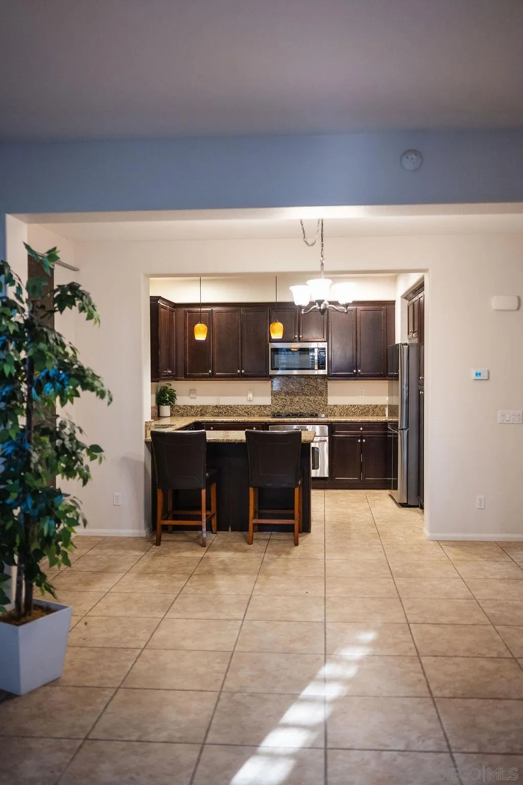 1808 Cyan Lane Chula Vista, CA 91913 - Photo 15 of 43 a kitchen with a refrigerator and a sink