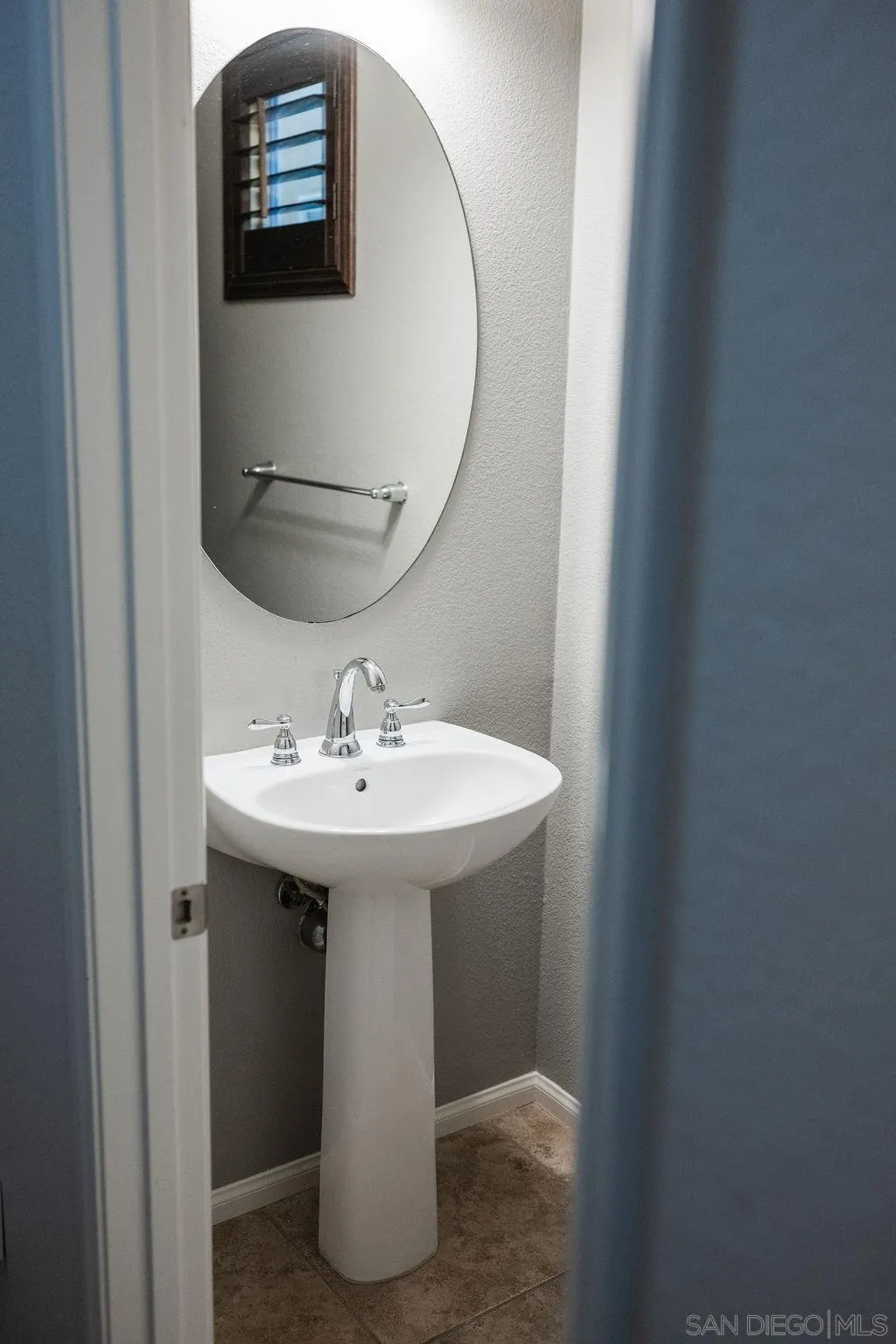 1808 Cyan Lane Chula Vista, CA 91913 - Photo 21 of 43 a bathroom with a sink and mirror