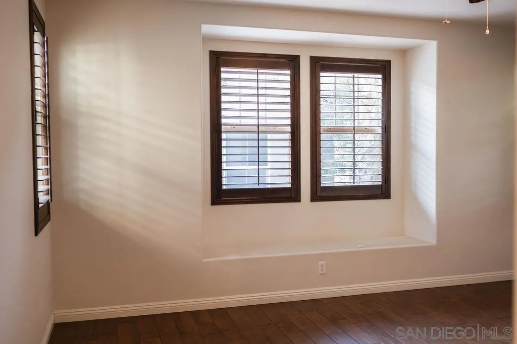 1808 Cyan Lane Chula Vista, CA 91913 - Photo 25 of 43 an empty room with wooden floor and windows