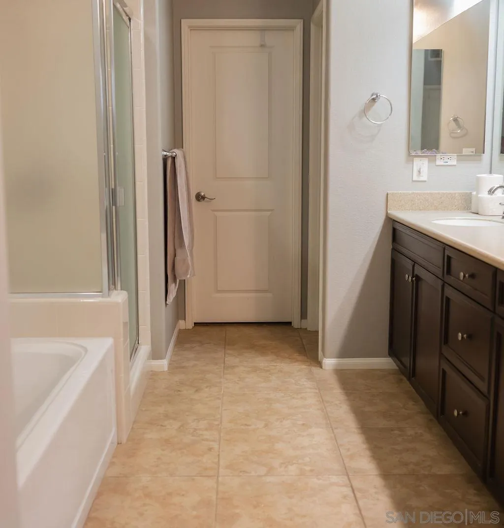 1808 Cyan Lane Chula Vista, CA 91913 - Photo 27 of 43 a bathroom with a sink and a mirror