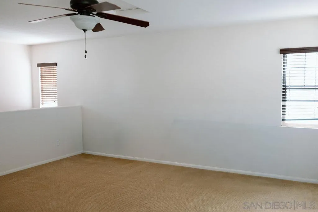 1808 Cyan Lane Chula Vista, CA 91913 - Photo 30 of 43 an empty room with a window and a fan