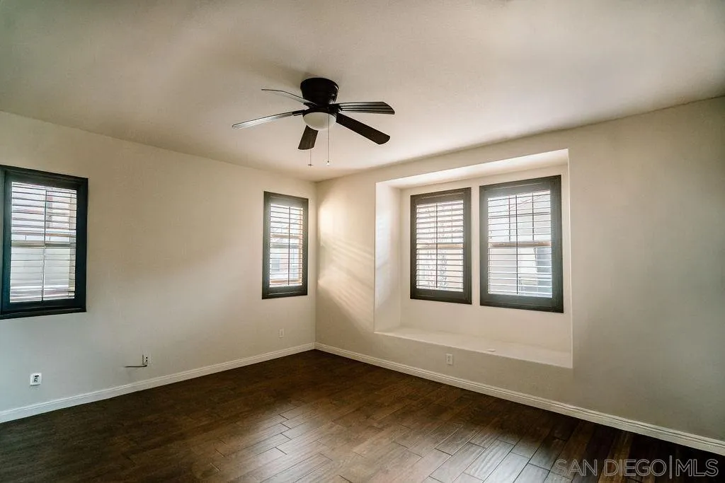 1808 Cyan Lane Chula Vista, CA 91913 - Photo 32 of 43 a view of an empty room with wooden floor and a window