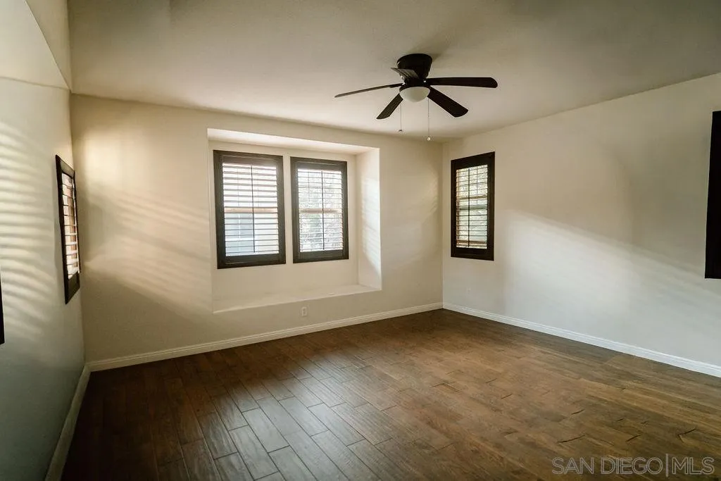 1808 Cyan Lane Chula Vista, CA 91913 - Photo 33 of 43 a view of empty room with wooden floor and fan
