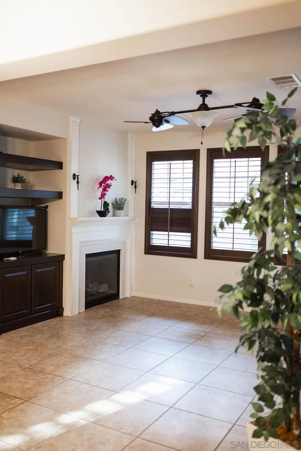 1808 Cyan Lane Chula Vista, CA 91913 - Photo 7 of 43 a view of an empty room with a fireplace and a window