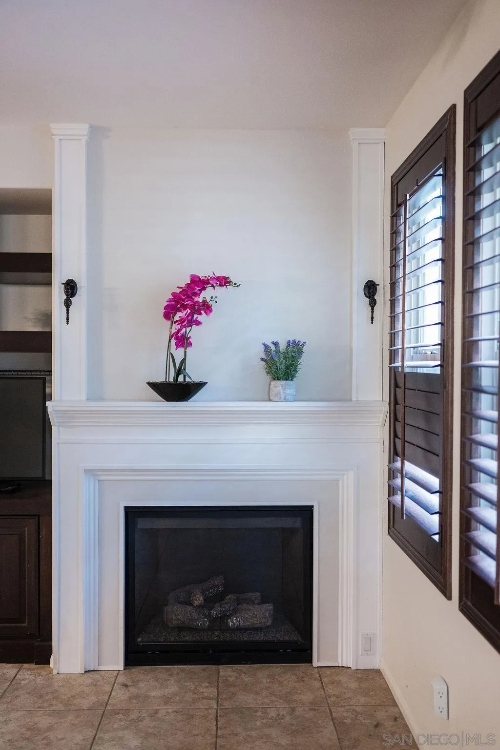 1808 Cyan Lane Chula Vista, CA 91913 - Photo 10 of 43 a living room with a fireplace and a fireplace