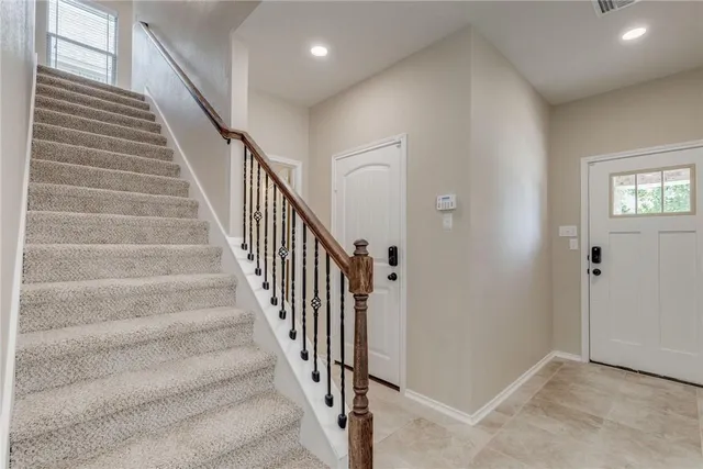 a kitchen with stainless steel appliances a sink stove and cabinets