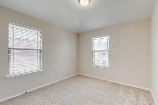 a bathroom with a shower sink and mirror