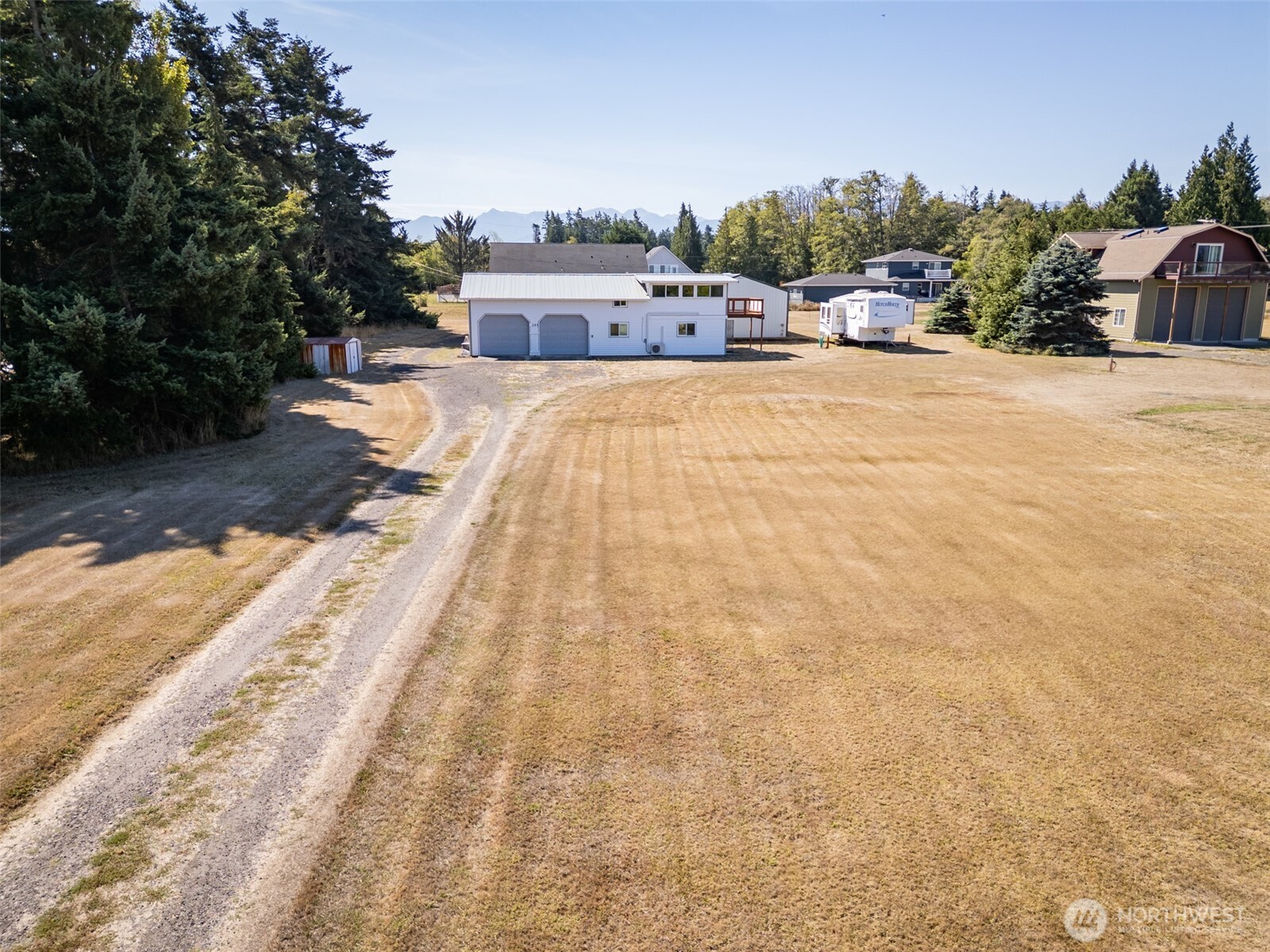 50 Nelson Road East Sequim, WA 98382 - Photo 9 of 40 a view of a house with swimming pool