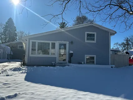 a house that has a tree in front of it
