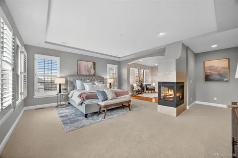 a bed room with furniture and a fireplace