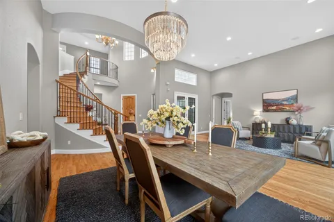 a view of a dining room with furniture and chandelier