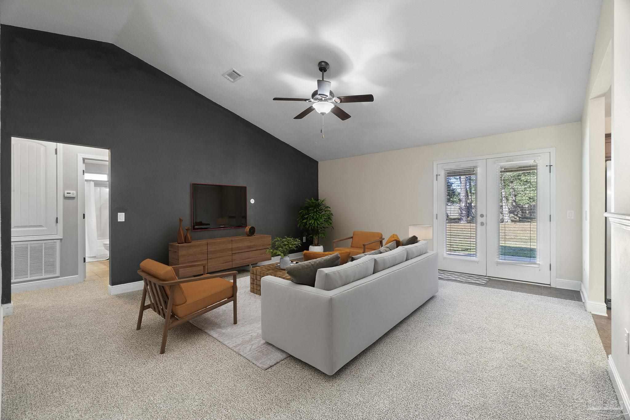 5607 Cane Syrup Circle Pace, FL 32571 - Photo 12 of 54 a living room with furniture and a chandelier