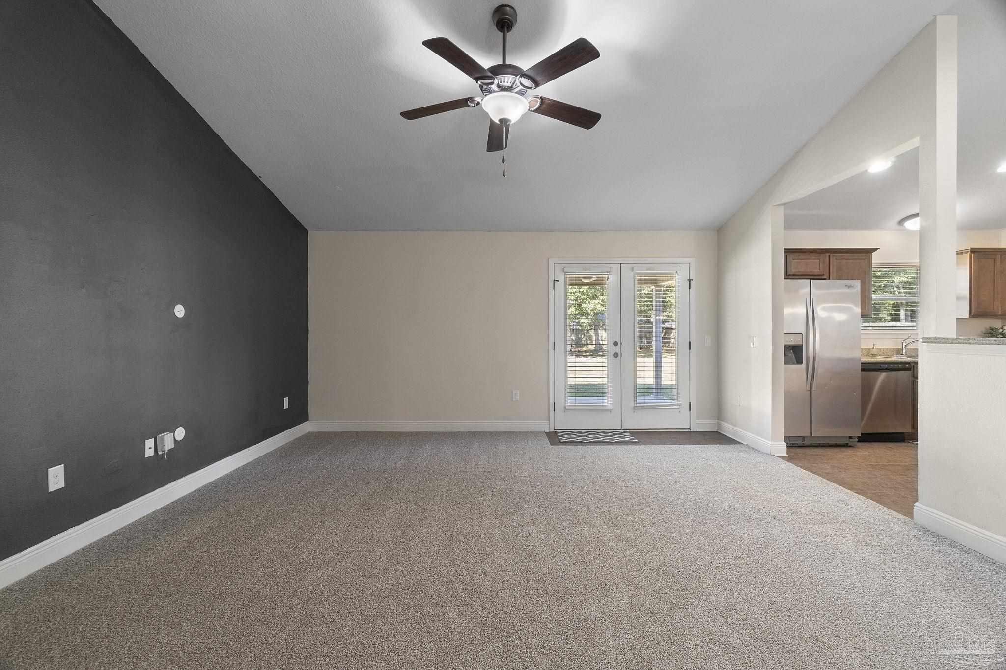 5607 Cane Syrup Circle Pace, FL 32571 - Photo 13 of 54 a view of a livingroom with a ceiling fan and window
