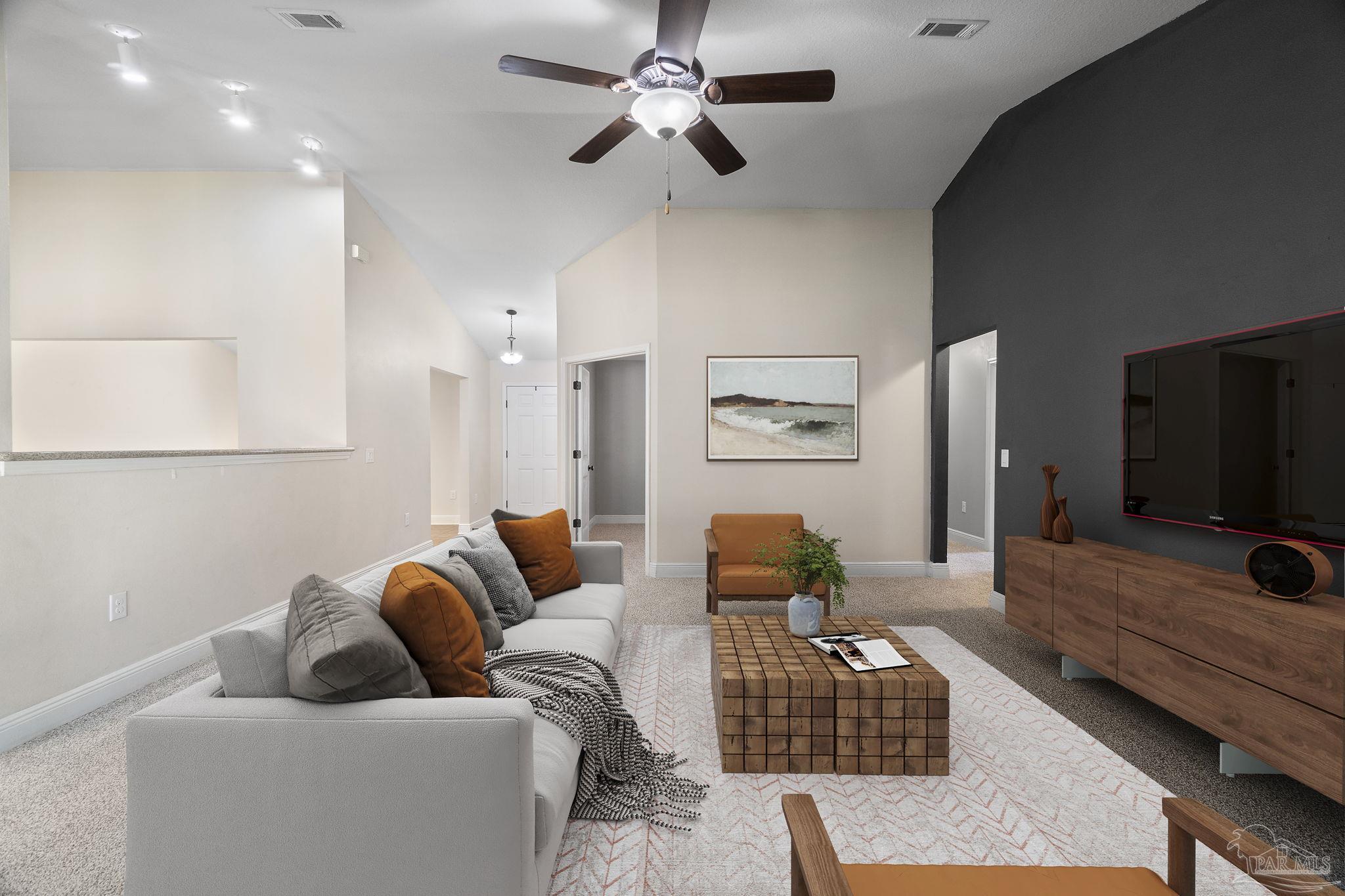 5607 Cane Syrup Circle Pace, FL 32571 - Photo 14 of 54 a living room with furniture and a flat screen tv